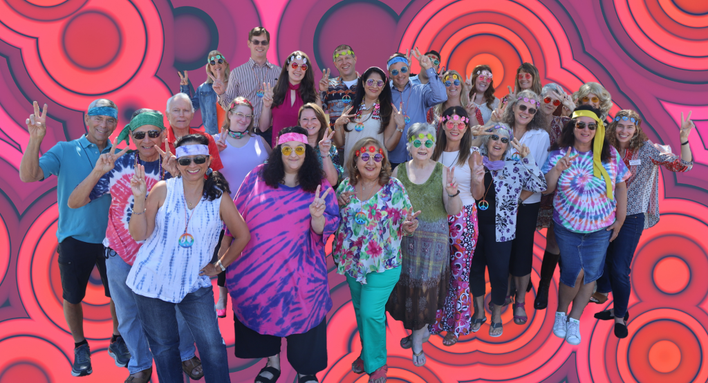 Large group of people in 1970s outfits